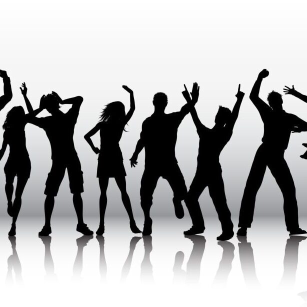 Silhouettes of a group of people dancing